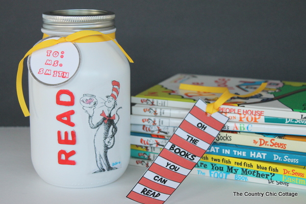 dr seuss gift in a jar next to stack of books and homemade bookmark