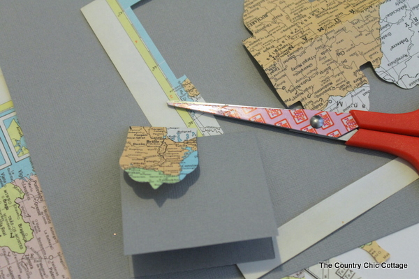 Recycled Map Placecards -- make placecards for your next party or a wedding from recycled maps with these great ideas. assembling wedding name cards