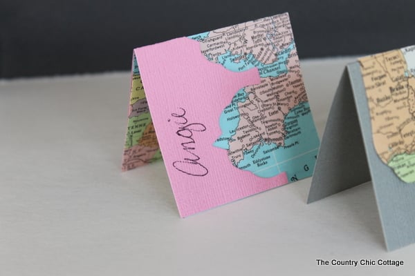 Recycled Map Placecards -- make placecards for your next party or a wedding from recycled maps with these great ideas. Finished name cards