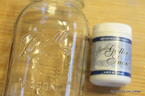 Solar Mason Jar Lights -- add tops to your mason jars and use solar power to light up the outdoors. mason jar and jar of glitter snow