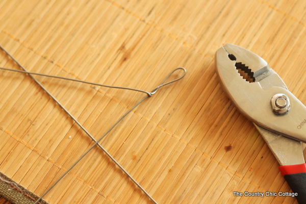 Solar Mason Jar Lights -- add tops to your mason jars and use solar power to light up the outdoors. Using pliers to twist wire to create a handle