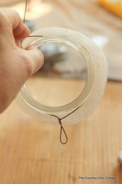 adding wire to mouth of jar to make a handle