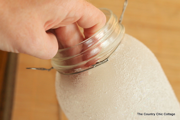 wrapping wire around the mouth of the mason jar