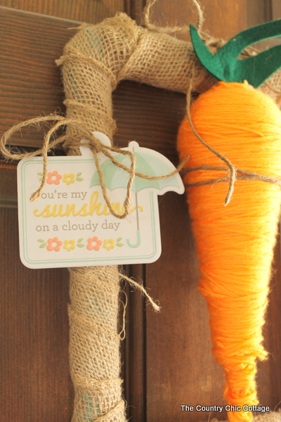 Carrot Spring Wreath -- grab some StyroFoam to make a fun carrot then add to a rectangular wreath. A fun spring wreath that is cute and unique.
