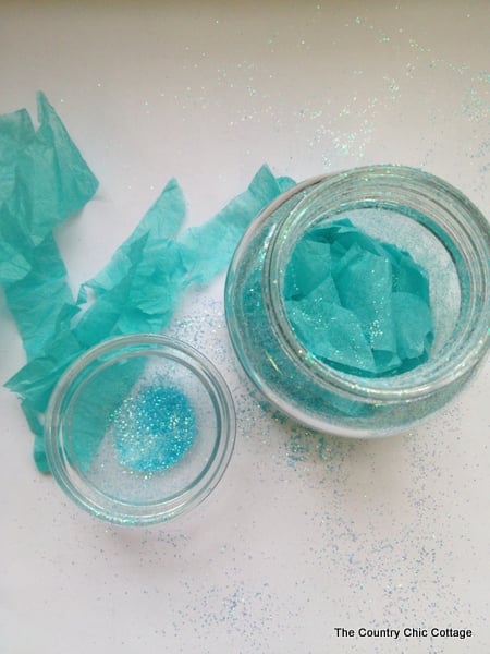 tissue paper, glitter, and glass jar