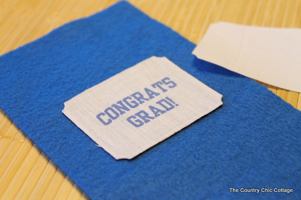 blue felt fabric with graduate saying