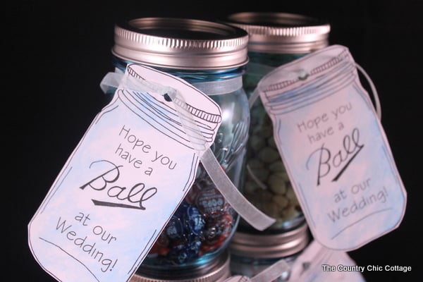 Mason Jar wedding favors with free printable tags -- love mason jars and these tags and they are available to print in a variety of "Ball" jar sayings! two mason jars with wedding tags