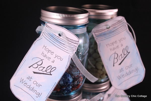 two mason jars with wedding tags