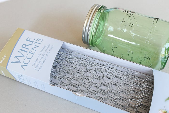 Chicken wire and green quart mason jar