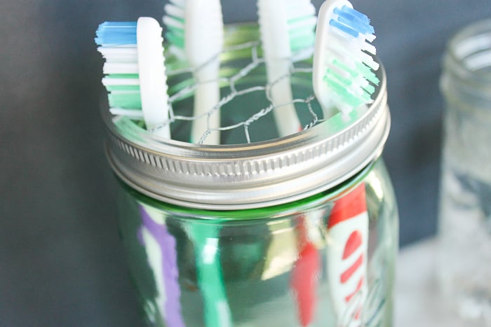 Mason jar toothbrush holder made with chicken wire