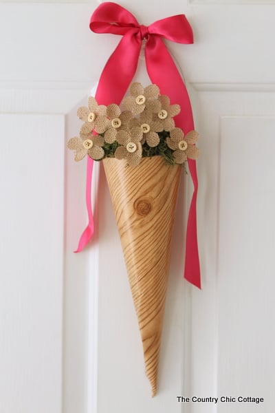 Spring Cone Wreath -- a fun alternative to a wreath for your front door. Spring Cone Wreath with burlap flowers