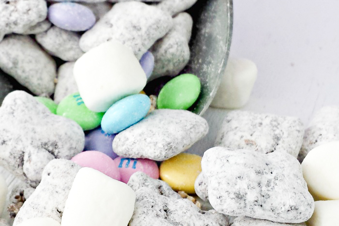 Close up shot of white chex cereal, mini marshmallows, and M&M candies.