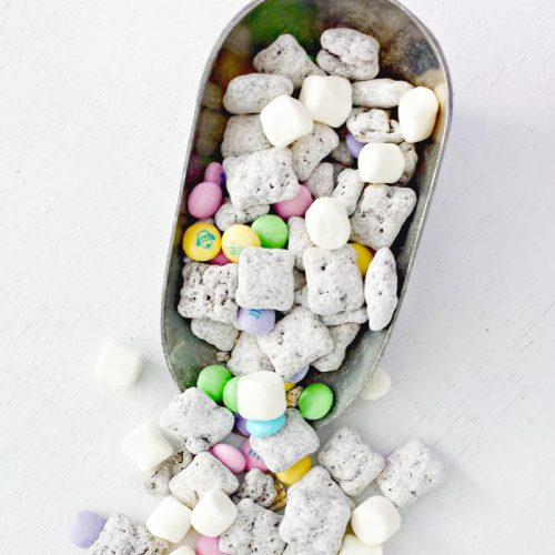 Top shot of easter muddy buddies in candy scoop.