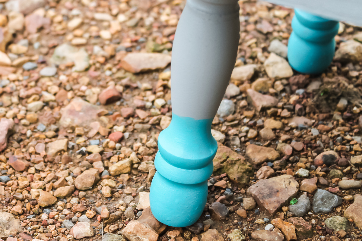 paint dipped legs on a stool