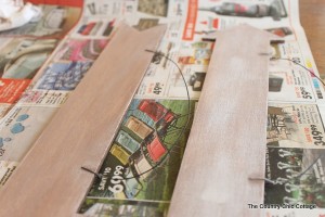 Wooden wedding signs on newspaper