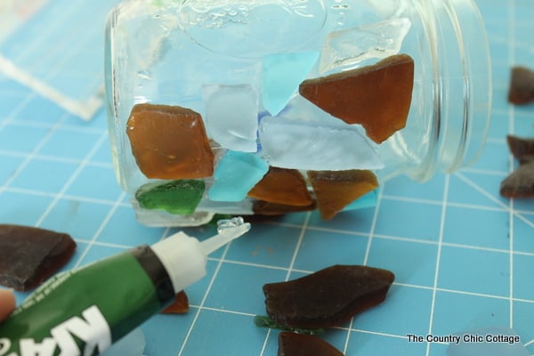 gluing sea glass to a mason jar