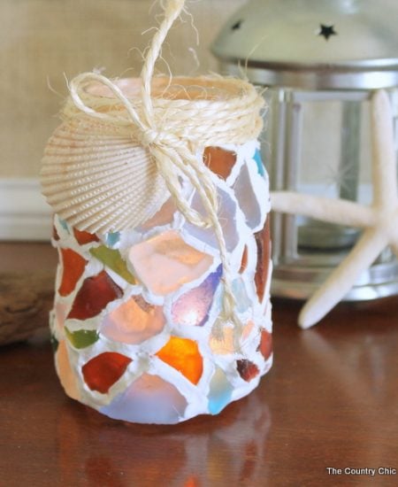 Sea Glass Mason Jar -- a fun way to use your sea glass collection. Make this mason jar candle holder easily!