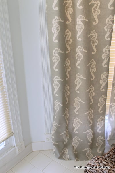 How to Sew Curtains: hanging curtain to determine where to cut the fabric for the bottom hem