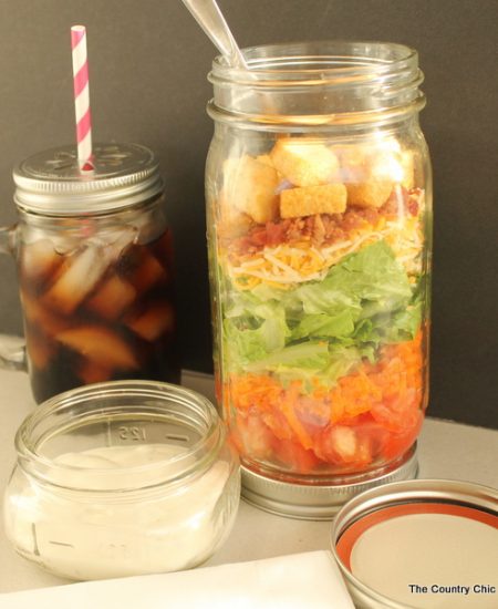 Mason Jar Salad Container -- make your own stacked salad container for easy healthy eating on the go. Click here to learn how.