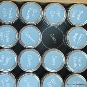 Organizing spices with mason jars -- learn how to use mason jars and chalkboard paper to organize your spice drawers. A great kitchen organization idea!