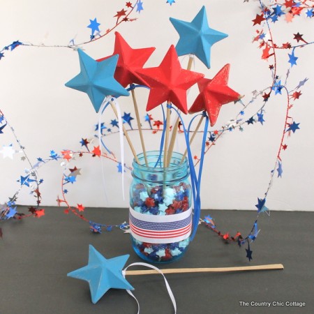 Patriotic Wand Centerpiece -- make a fun centerpiece with patriotic wands for your Fourth of July party. The kids can take home the wands at the end of the night.