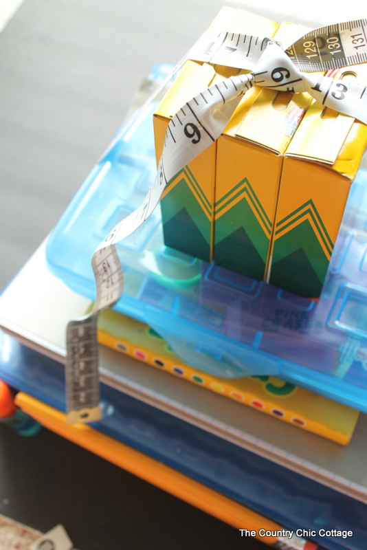 top view of crayons and plastic box with tape measure