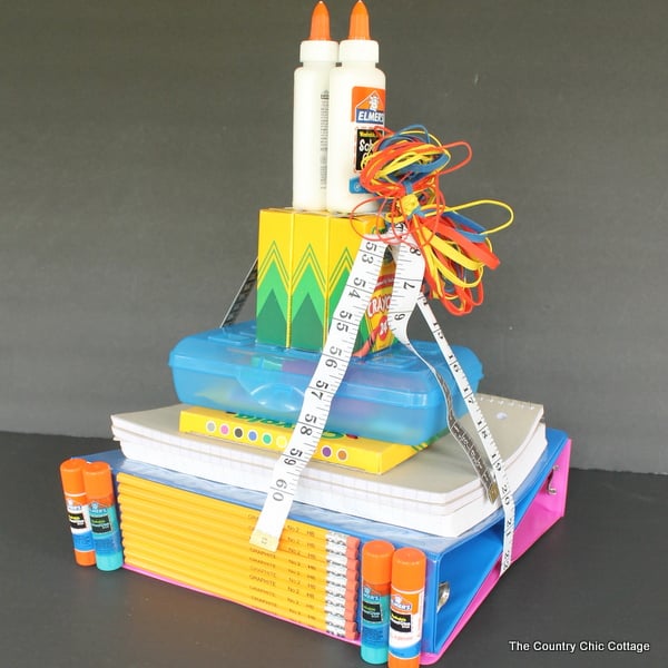 front view of school supplies tower with crayons and glue