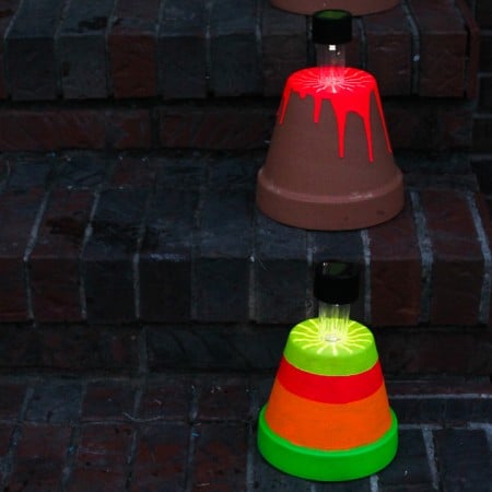 terra cotta pots holding solar lights