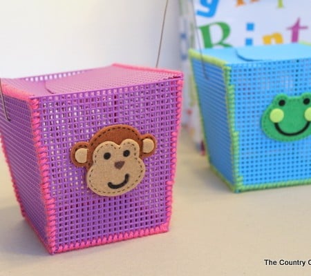 Plastic Canvas Storage Boxes -- a great craft for kids at summer camp or anytime of the year. Helps to teach basic sewing skills as well.