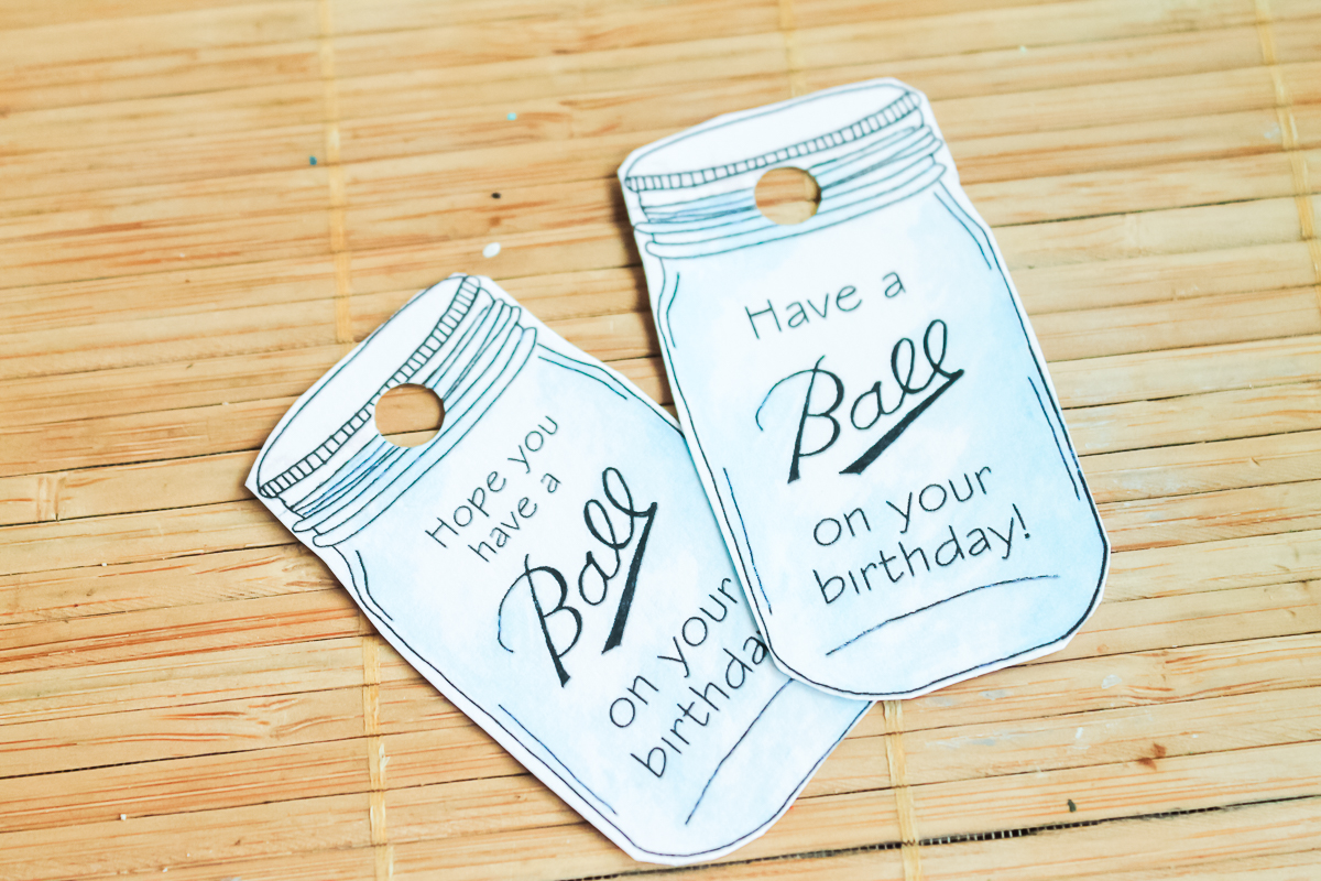 tags for a birthday gift cut out with a hole punched in them