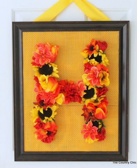 Floral Monogram Wreath -- supplies from Dollar General transform into a gorgeous one of a kind wreath. Get the full instructions for making your own here.