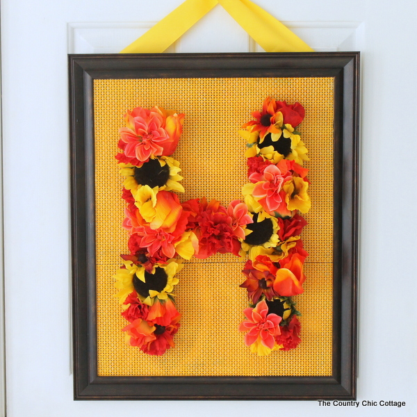 Floral Monogram Wreath -- supplies from Dollar General transform into a gorgeous one of a kind wreath. Get the full instructions for making your own here.