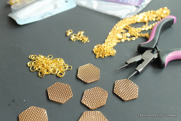 Gather your jewelry making supplies, including chains and clasps 