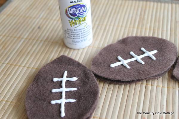 Mini Football Cornhole Game -- a fun mini size version of the original.  Perfect for kids or indoors!  Click here to see how to make your own.