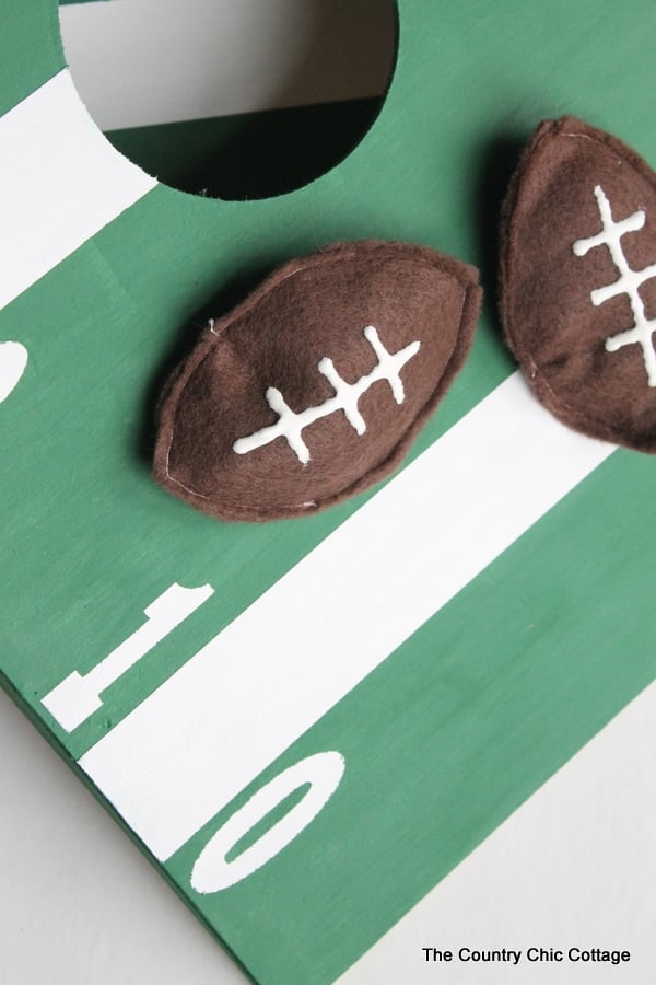 Mini Football Cornhole Game -- a fun mini size version of the original.  Perfect for kids or indoors!  Click here to see how to make your own.