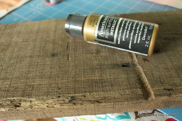 Rustic Gold Centerpiece -- mix gold with barn wood for an elegant yet rustic table centerpiece.