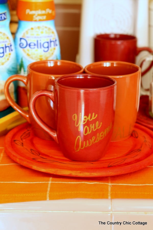 Fall Coffee Mugs -- use a simple paint pen to make fall themed coffee mugs in minutes!