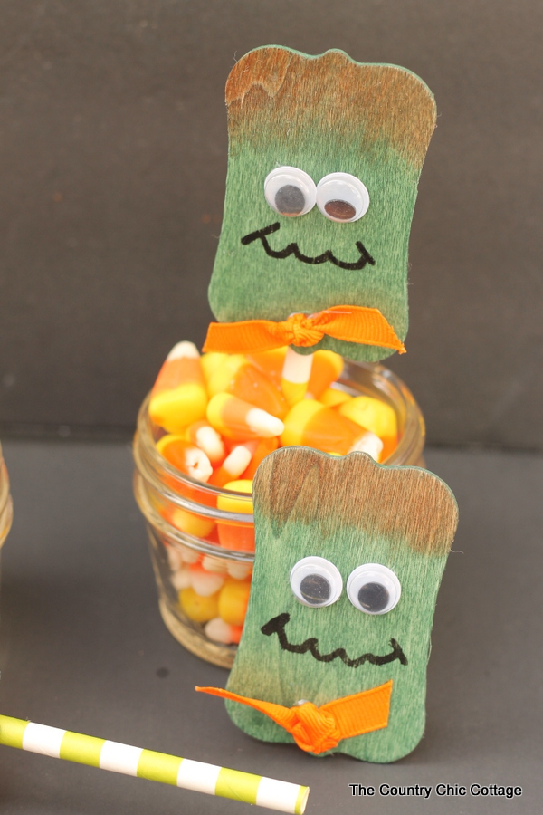 Frankenstein Wood Projects -- Halloween ideas using wood tags to make Frankenstein pins and cupcake toppers!