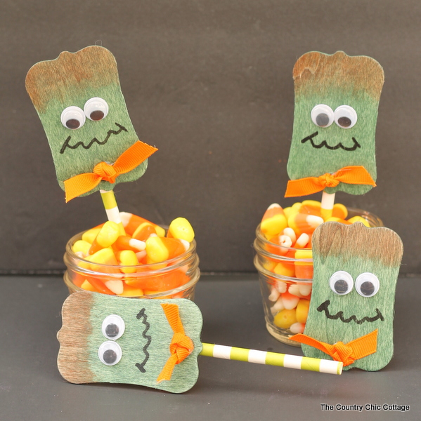 Frankenstein Wood Projects -- Halloween ideas using wood tags to make Frankenstein pins and cupcake toppers!