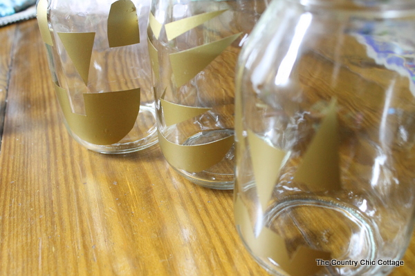 Halloween Jar Luminaries -- light up the night this Halloween with these quick and easy to make mason jar luminaries! 