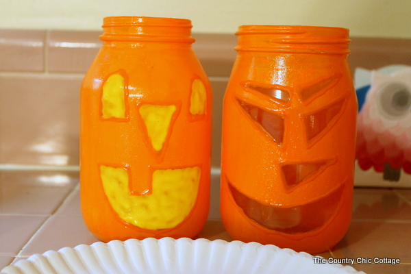 adding yellow enamel paint to mason jars