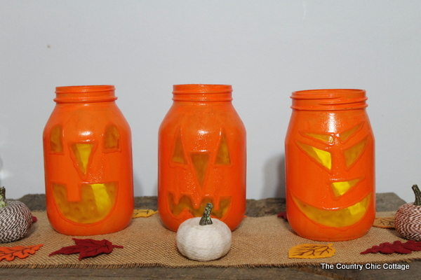 adding tealights to mason jars