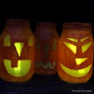 Halloween Jar Luminaries -- light up the night this Halloween with these quick and easy to make mason jar luminaries!