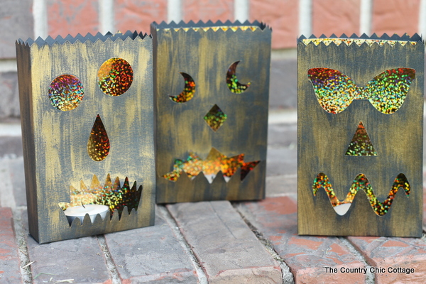 Halloween Luminary Bags with the Cricut Explore -- cut these fun bags, paint, and add a candle. These amazing black and gold bag with light up the night at your Halloween party!