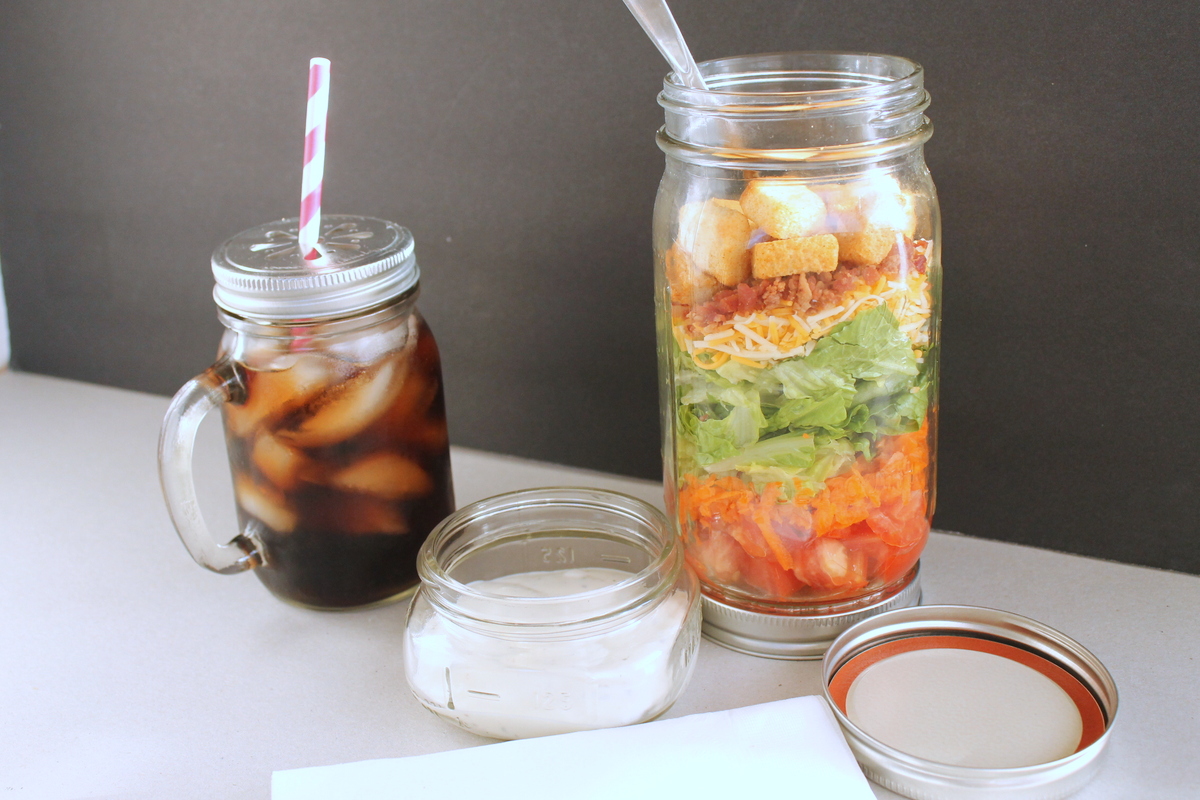 How to Assemble a Mason Jar Salad -- grab your ingredients and throw together an amazing salad in a mason jar. Great instructions on how to keep your salad fresh!