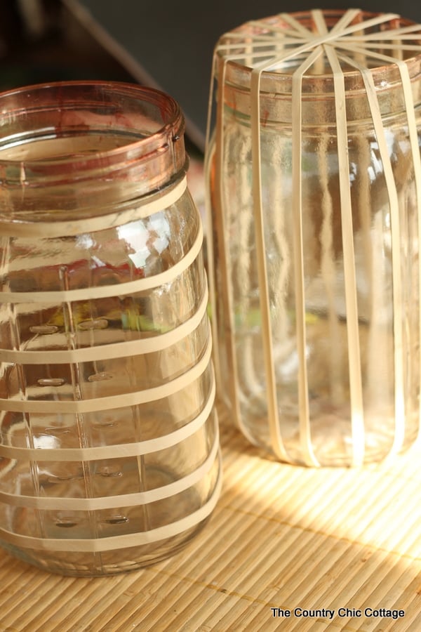 adding rubber bands for masking to make fun painted jars