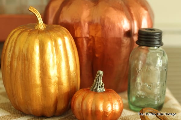 Metallic Painted Pumpkins in a grouping on a table