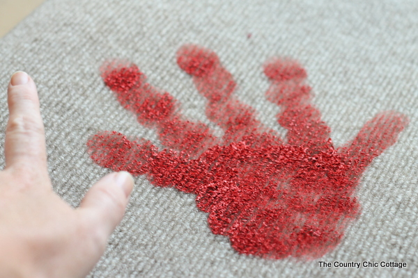 painting bloody handprint on doormat