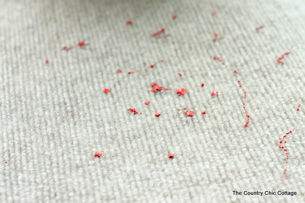 painting blood splatter on Halloween door mat