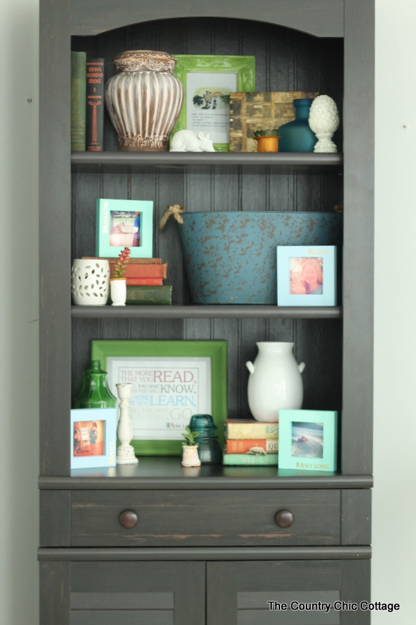 Style a Bookcase in 4 minutes or less -- tips and techniques on arranging items in a bookcase or any shelf!